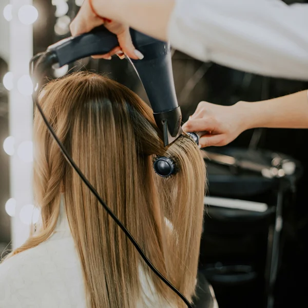 client having her hair styled